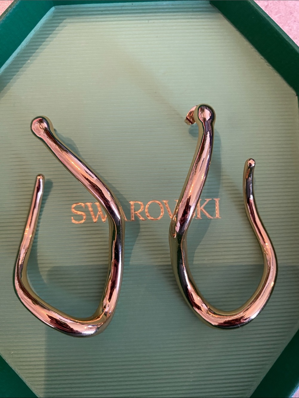 Contemporary gold hoop earrings. Artsy, chic, statement piece.